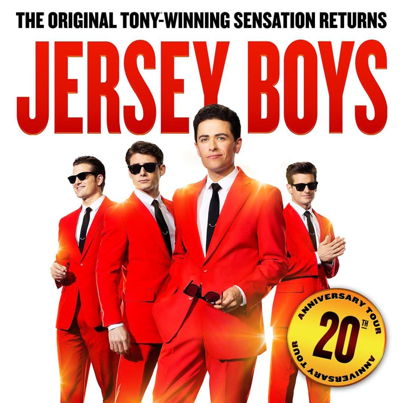 Four men in bright red suits, two wearing sunglasses, stand confidently against a white background. Bold red text reads "Jersey Boys" above them.