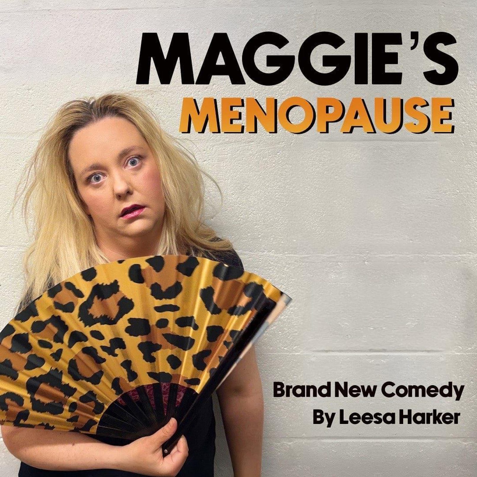 A woman with long blonde hair holds a leopard print fan, looking exasperated. Text reads, "Maggie's Menopause, Brand New Comedy By Leesa Harker."