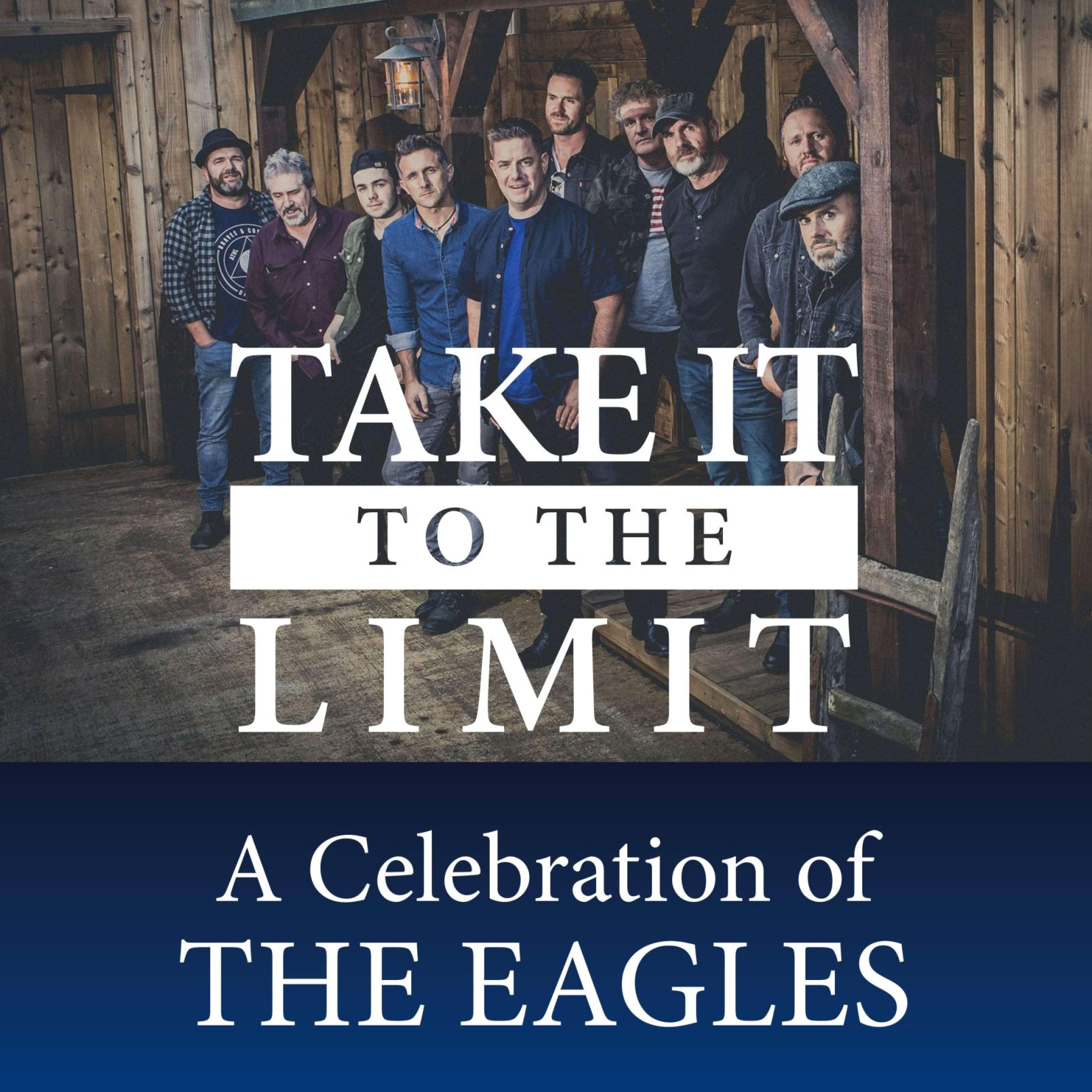 A group of men stands in a rustic wooden setting, exuding a casual and friendly vibe. Overlaid text reads, "Take It to the Limit: A Celebration of The Eagles."