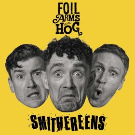 Black and white portraits of the three members of Foil Arms and Hog with exaggerated expressions on a yellow background, featuring the text "Foil Arms and Hog" at the top and "Smithereens" at the bottom.
