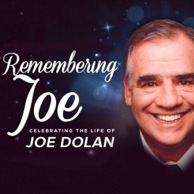 Smiling man with text "Remembering Joe, Celebrating the Life of Joe Dolan" on a starry background. Warm, nostalgic tone.