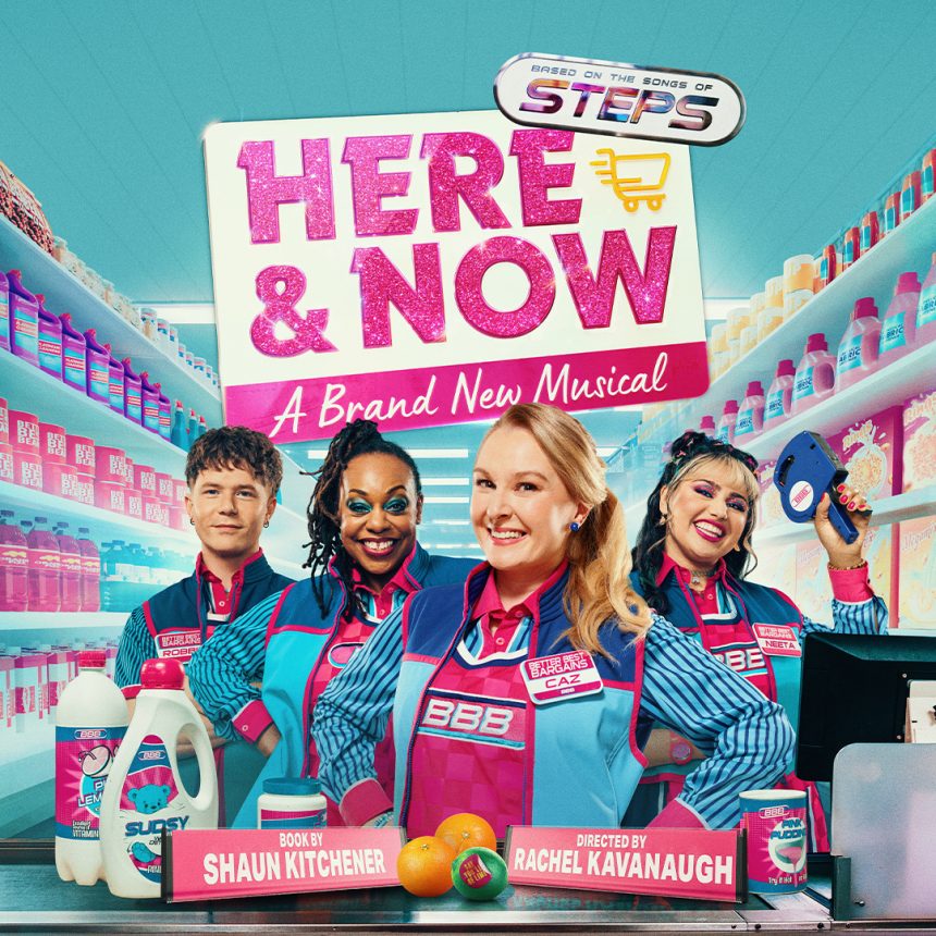 A vibrant promotional poster for "Here & Now: A Brand New Musical" features four smiling people in colourful uniforms inside a brightly lit supermarket. The words "Here & Now" are prominently displayed in pink, glittery text above them. A shopping cart icon is incorporated in the text. Shelves packed with various products surround them, and a conveyor belt is visible with bottles and oranges. The tone is cheerful and energetic.